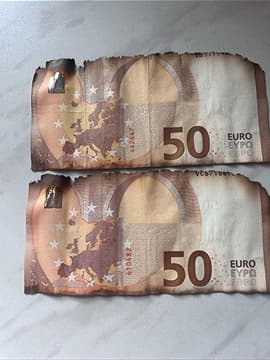 Пошкоджені купюри долара та євро